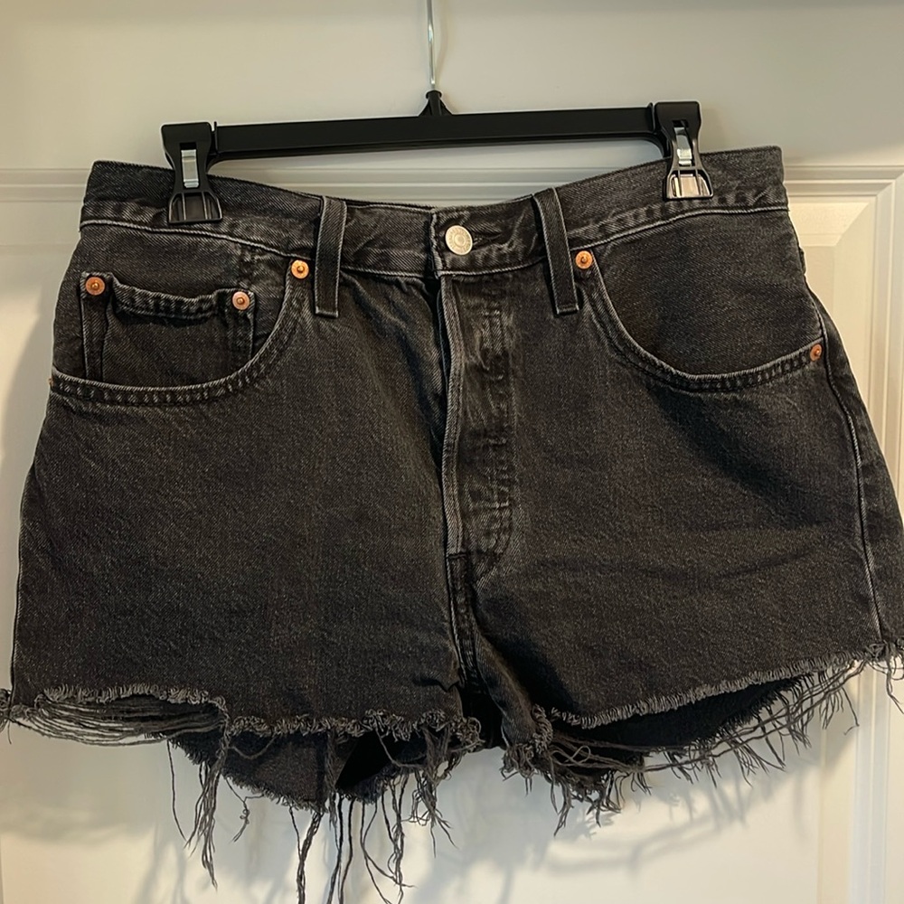 Levi’s 501 black distressed high waisted jean shorts